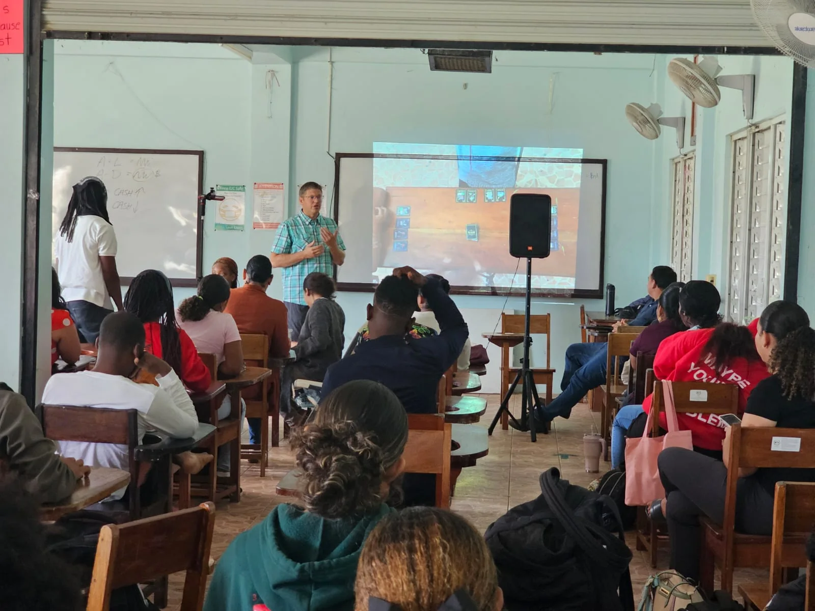 Financial literacy presentation to students in a classroom